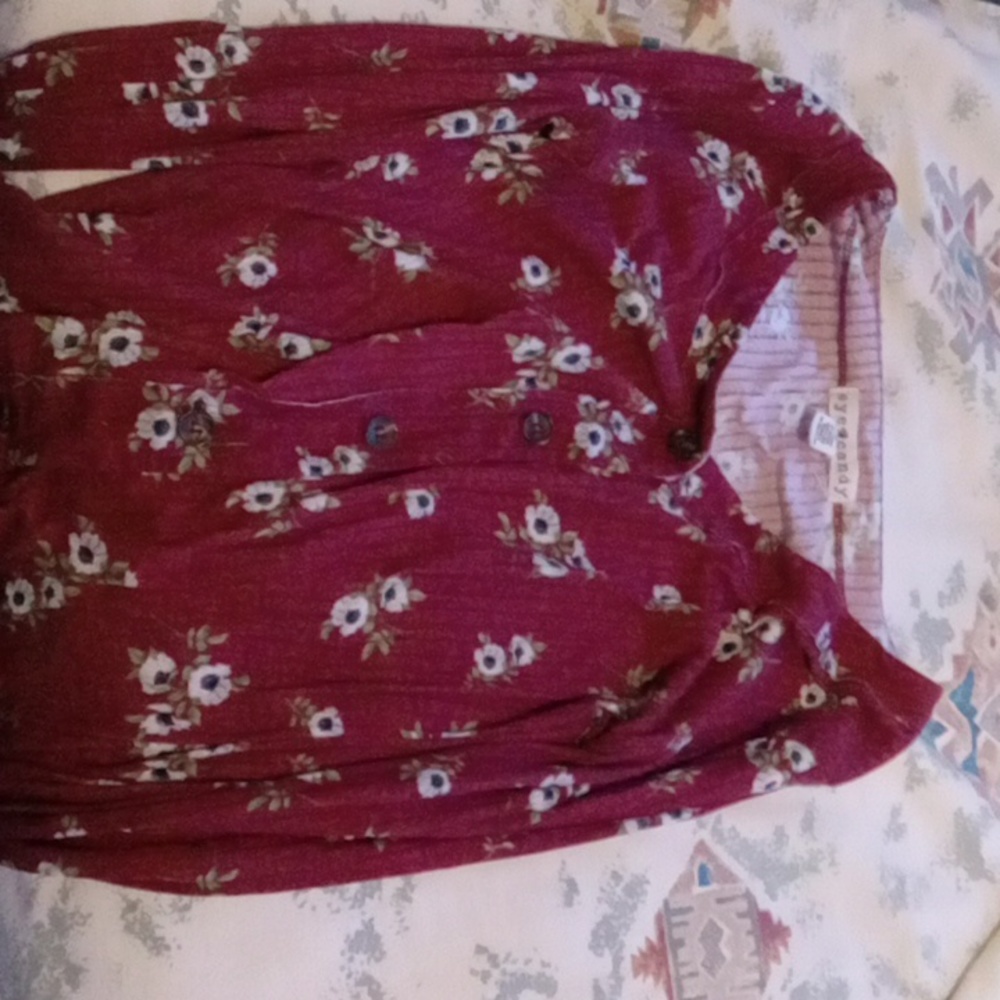 A small red & floral patterned sweater thingy